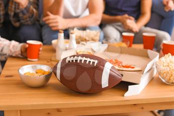 Table with tasty snacks during watching rugby on TV�