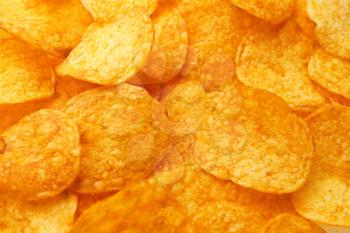 Tasty potato chips as background�