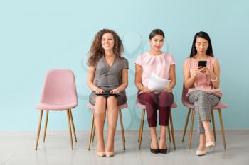 Young women waiting for job interview indoors�