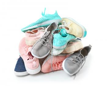 Heap of different shoes on white background�