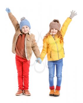 Cute little children in winter clothes on white background�