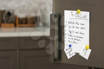 To-do list on fridge in kitchen�