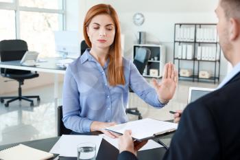 Bank manager working with displeased woman in office�