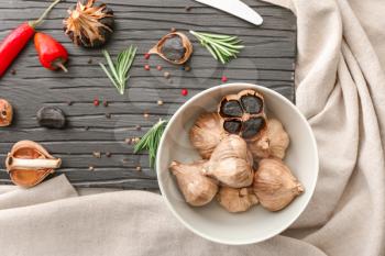 Composition with black garlic on table�