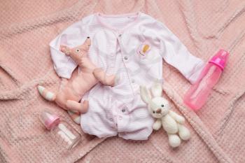 Baby clothes and accessories on plaid�