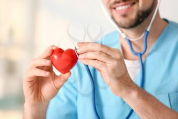 Male cardiologist in modern clinic, closeup�