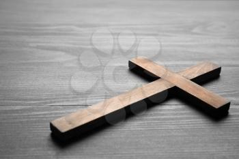 Christian cross on wooden background�