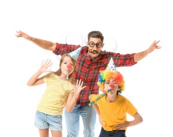 Family in funny disguise on white background. April fools' day celebration�