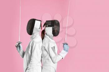 Young fencers on color background�
