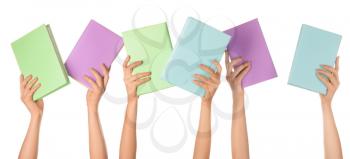 Female hands with books on white background�