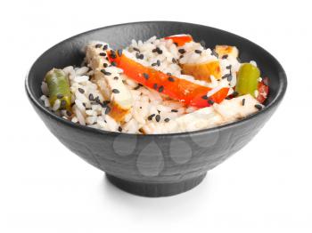 Bowl with tasty rice, chicken and vegetables on white background�