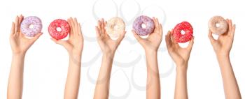 Female hands with sweet donuts on white background�