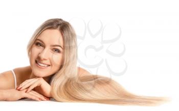 Beautiful young woman with long hair on white background�