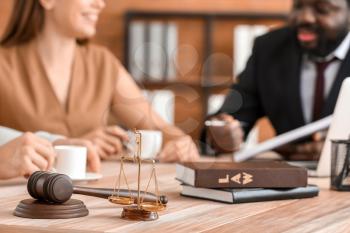 Scales of justice and gavel  on table of lawyer in office�