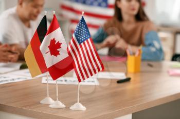 Flags of different countries on table at language school�