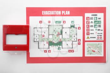 Evacuation plan and manual call point on white background�