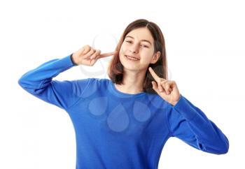 Teenage girl with dental braces on white background�