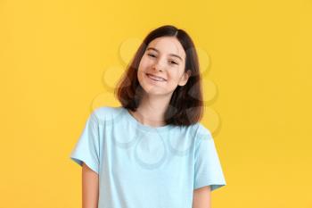 Teenage girl with dental braces on color background�