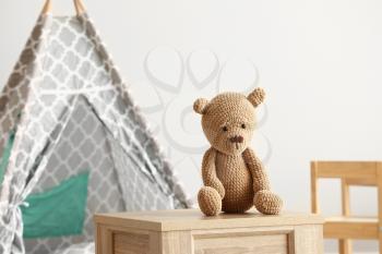 Cuddly toy on table in room�