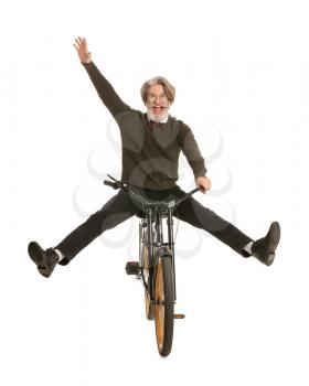 Happy elderly man with bicycle on white background�