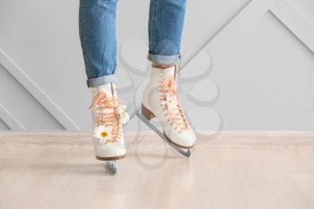Young woman in ice skate shoes indoors�