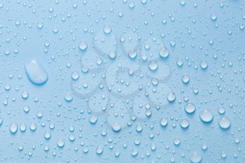 Drops of water on color background�