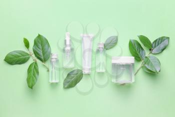 Different cosmetic products on color background�