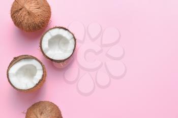 Ripe coconuts on color background�