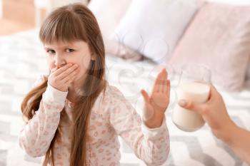 Little girl with milk allergy in bedroom�