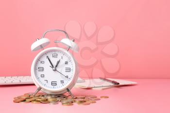 Alarm clock and coins on color background. Time management concept�