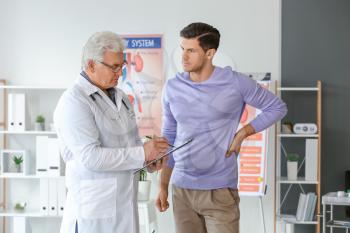 Young man visiting urologist in clinic�