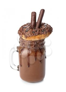Mason jar of hot chocolate with doughnut on white background�