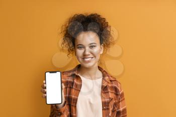 Beautiful young African-American woman with mobile phone on color background�
