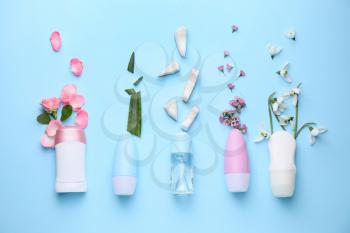 Different deodorants on color background�