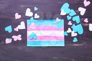 Flag of transgender with hearts on wooden background�