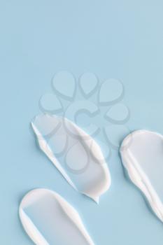 Samples of cream on color background�