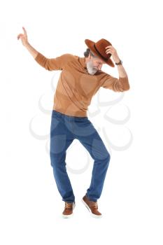 Cool senior man dancing against white background�