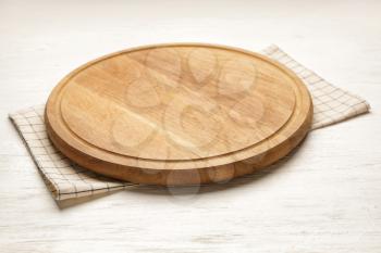 Cutting board on white wooden background�