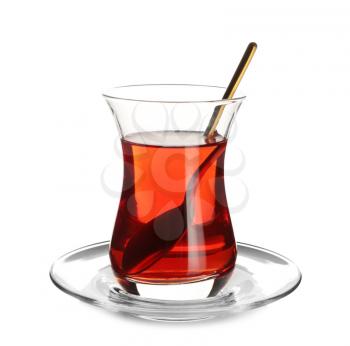 Glass of tasty Turkish tea on white background�