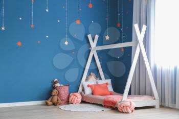 Interior of modern children's room with comfortable bed�