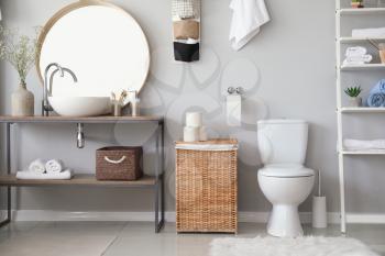Stylish interior of modern bathroom with toilet bowl�