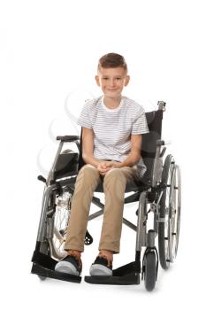 Boy in wheelchair on white background�