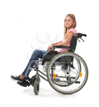 Teenage girl in wheelchair on white background�