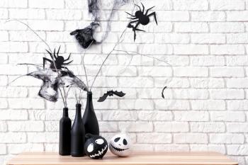 Creative decorations for Halloween party near brick wall�