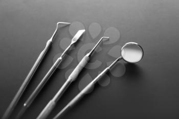 Dentist's tools on dark background�