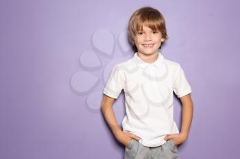 Little boy in t-shirt on color background�