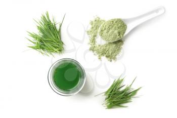Flat lay composition with wheat grass juice on white background�