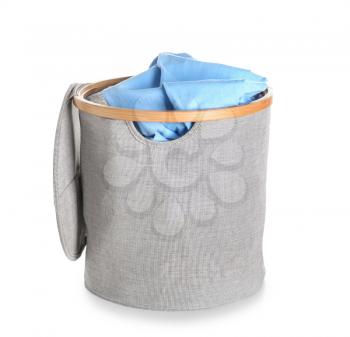 Laundry basket with dirty clothes on white background�