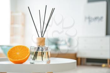 Reed diffuser on table in bedroom�