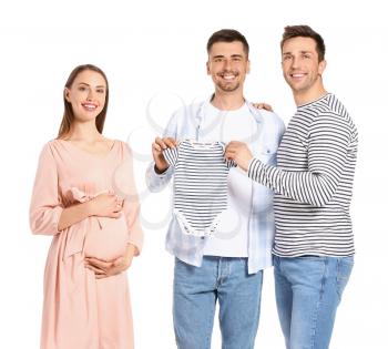 Gay couple and pregnant woman with baby clothes on white background�